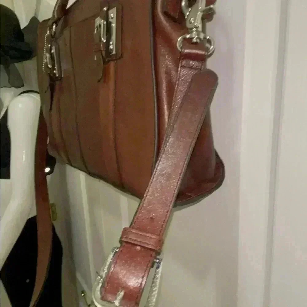 Wilson leather original back, rown color great conditions with adjstbel strap